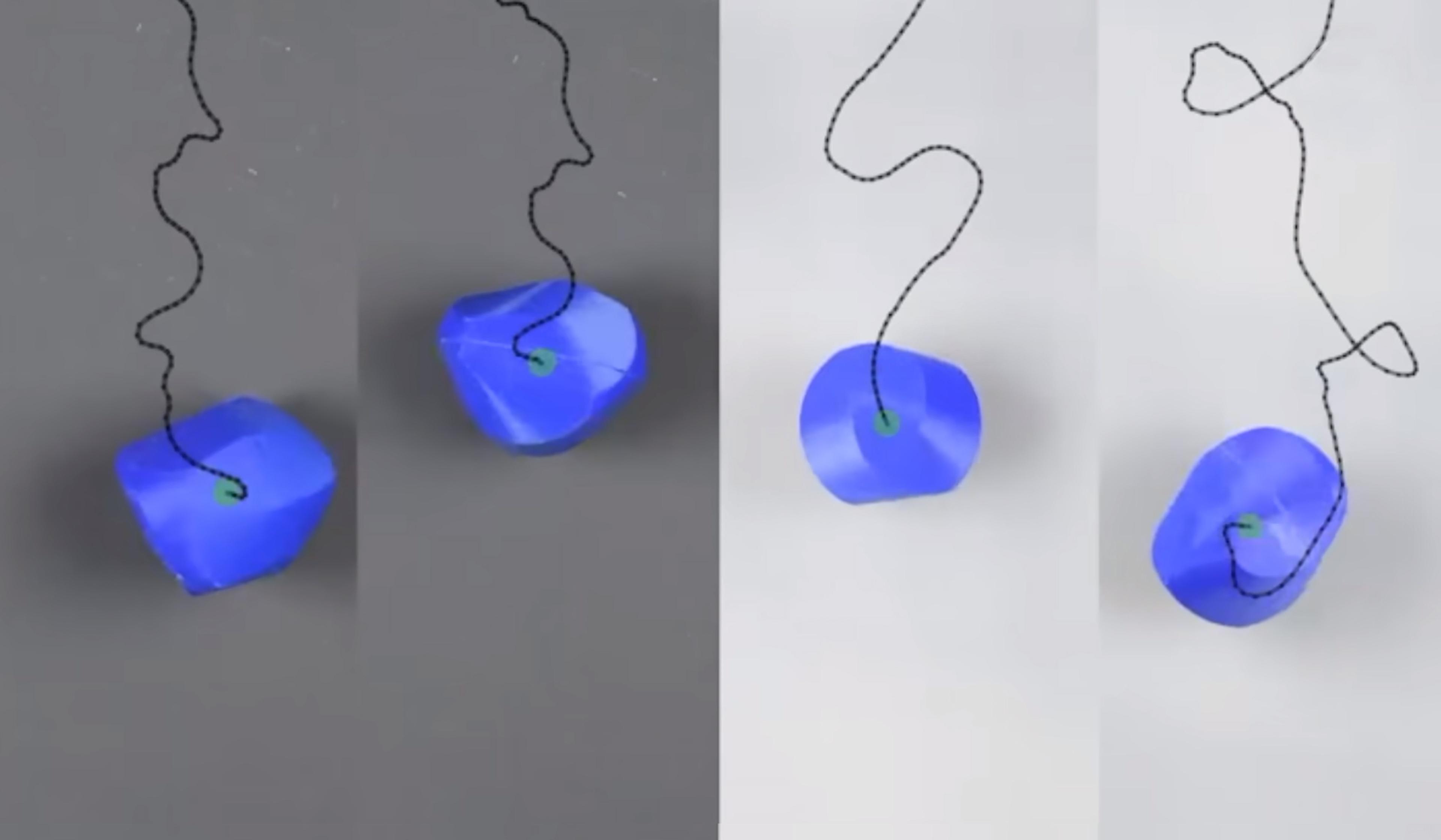 Four blue, irregularly shaped objects with black squiggly lines attached, displayed in a sequence against grey and white backgrounds.
