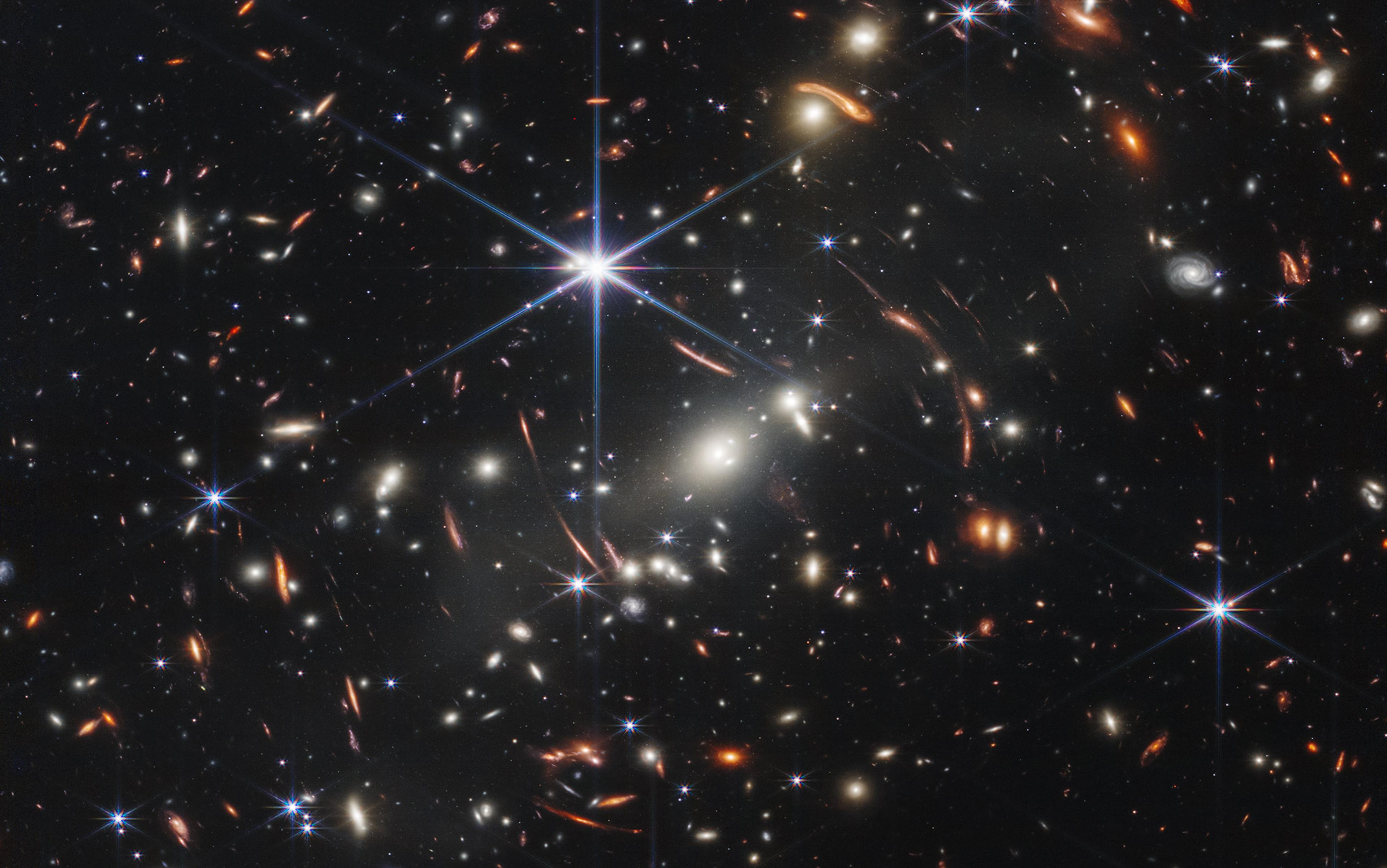 Deep space showing numerous galaxies, stars, and cosmic phenomena in varying colours, taken by the James Webb Space Telescope.